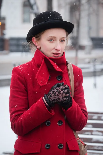 Girl in a red coat — Stock Photo, Image