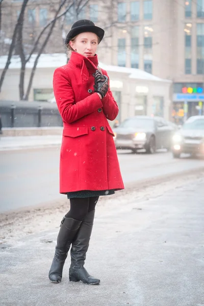 Girl in a red coat — Stock Photo, Image