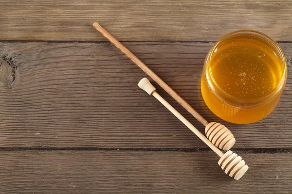 Honey on old wood background — Stock Photo, Image