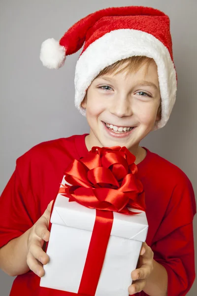 Smiling  funny child in Santa red hat — Stock Photo, Image