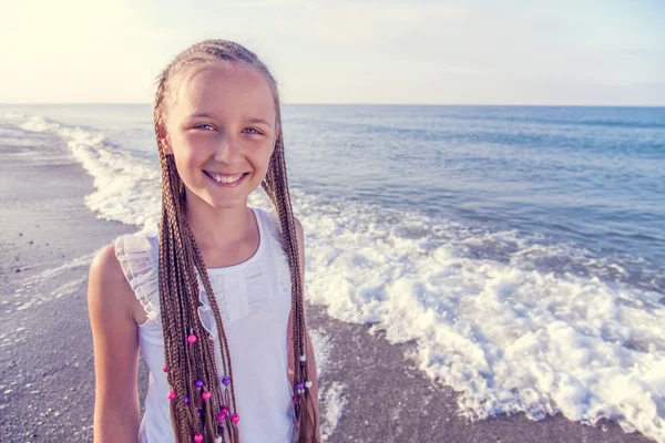 Portrait of a girl with long braids on her head — Stock Photo, Image