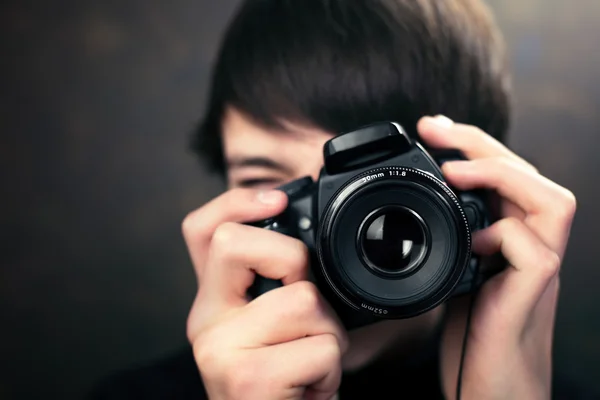 Teenager with digital compact camera — Stock Photo, Image