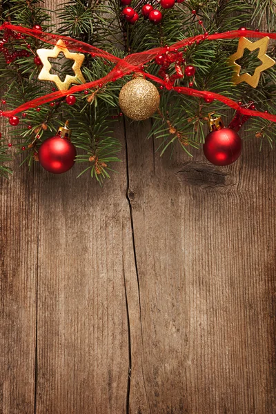 Old grunge wooden board with Christmas border. Royalty Free Stock Photos