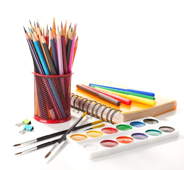School equipment with pencils, notebook,  paints and brushes — Stok fotoğraf