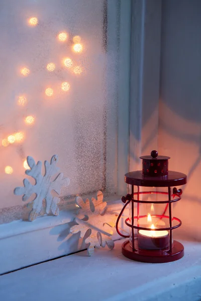 Red lantern in night on old window — Stock Photo, Image