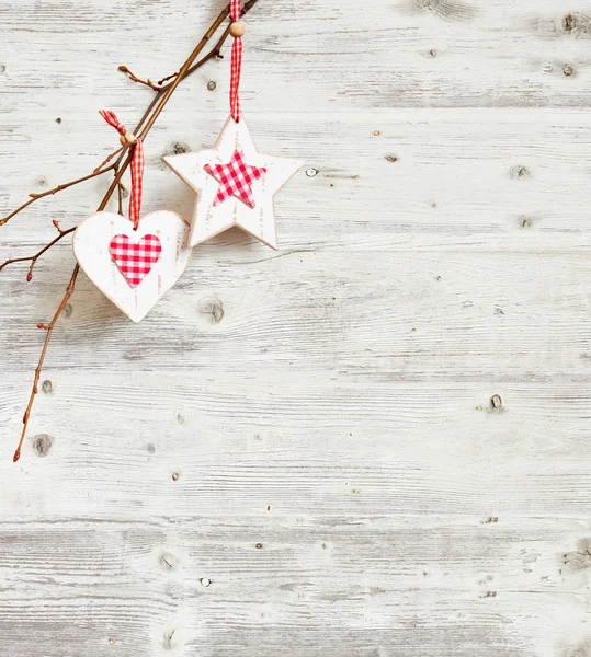 Christmas decoration hanging over grunge wooden board. — Stock Photo, Image