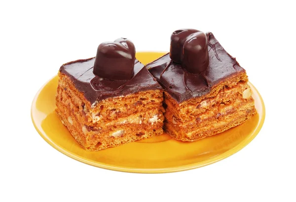 Chocolate cakes on orange plate — Stock Photo, Image