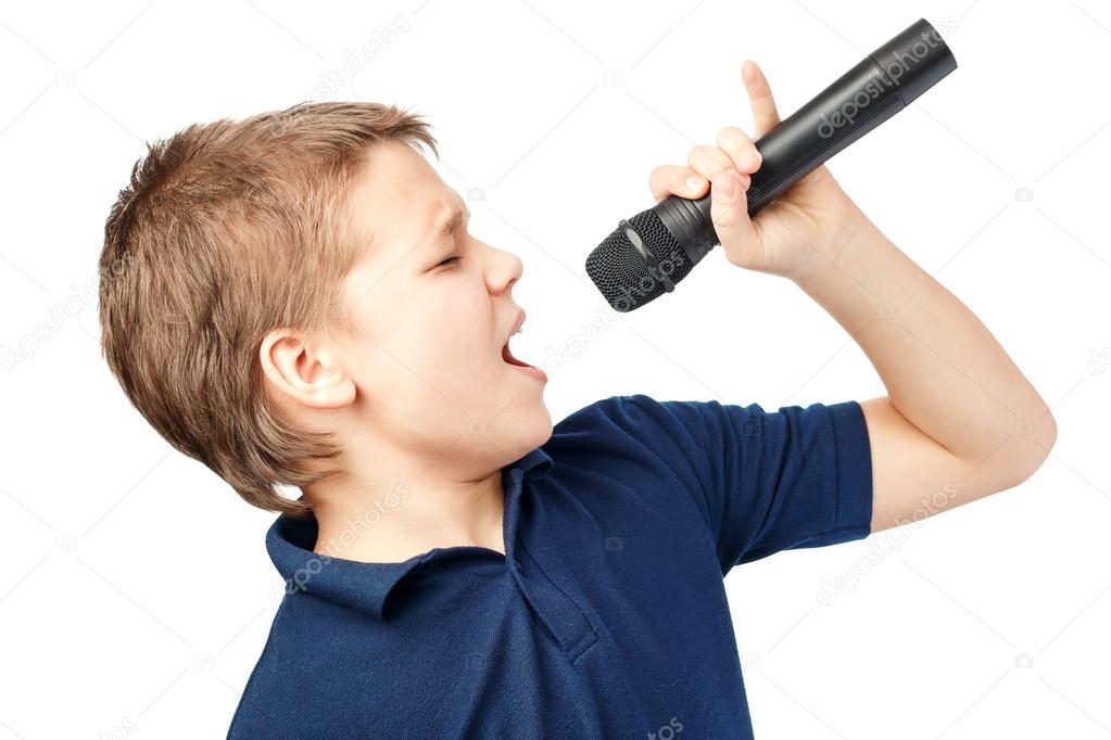 Boy singing into a microphone. Very emotional. Stock Photo by ©bond80 72400601