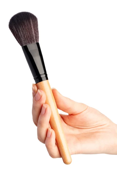 Make-up borstel in de hand — Stockfoto