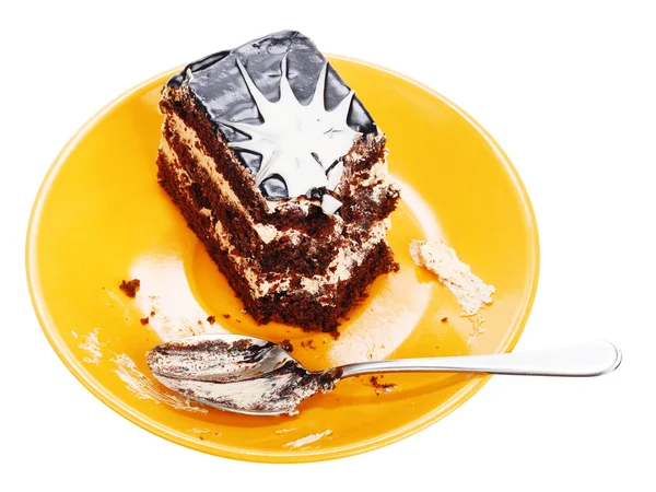 Chocolate cake on orange plate — Stock Photo, Image