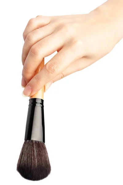 Escova de maquiagem na mão — Fotografia de Stock