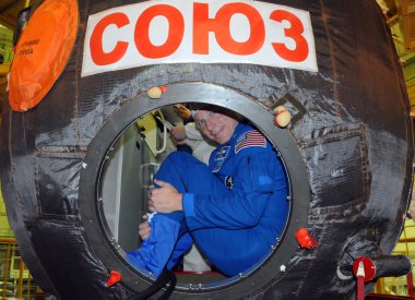 Terry Virts in Soyuz Spacecraft During Fit Check clipart