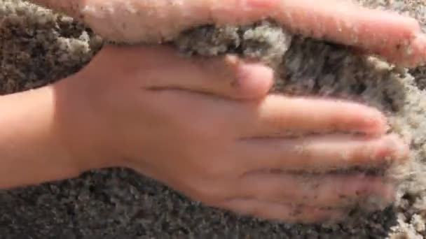 Hands building sand border — Stock Video