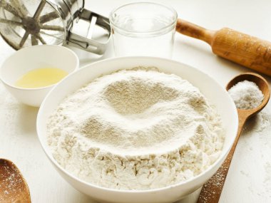 Dough kneading set of ingredients, preparation for baking. Shallow dof.