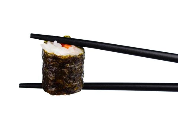 Sushi-Rolle in Essstäbchen isoliert auf weiß Stockbild