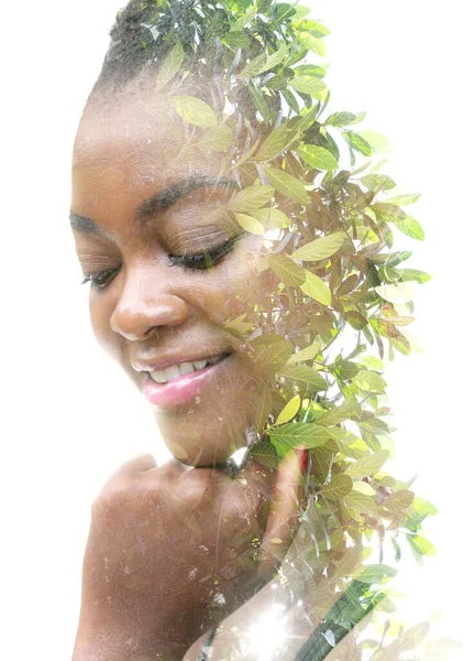Merging with nature. Double exposure portrait of an African American woman — Stock Photo, Image