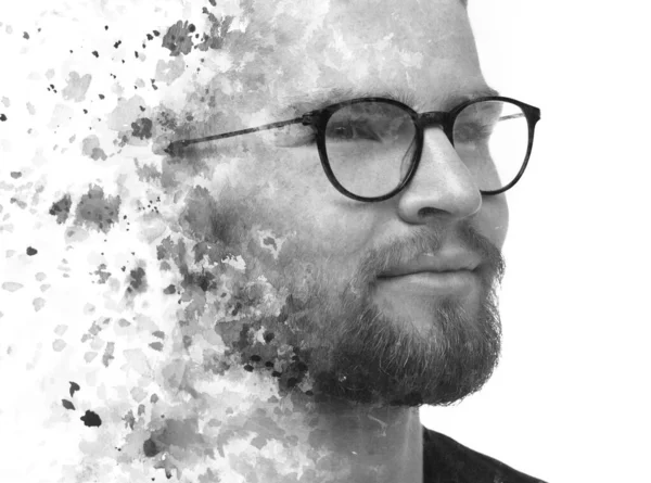 Double exposure of a black and white portrait of a man and watercolor splashes — Stock Photo, Image