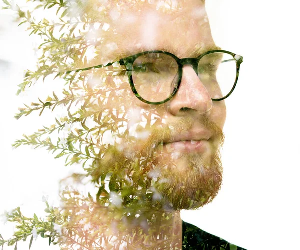 Portret mężczyzny połączony z liśćmi. Malarstwo. — Zdjęcie stockowe