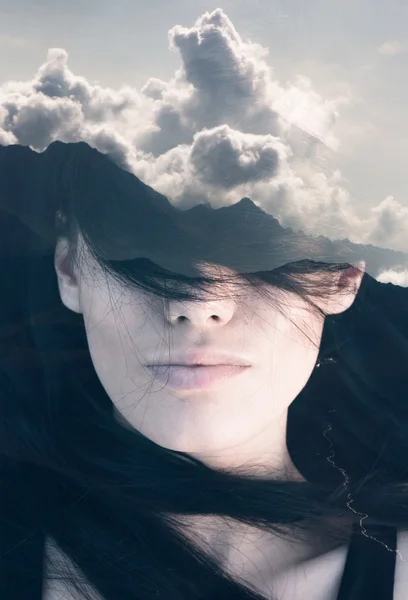 Woman with clouds — Stock Photo, Image