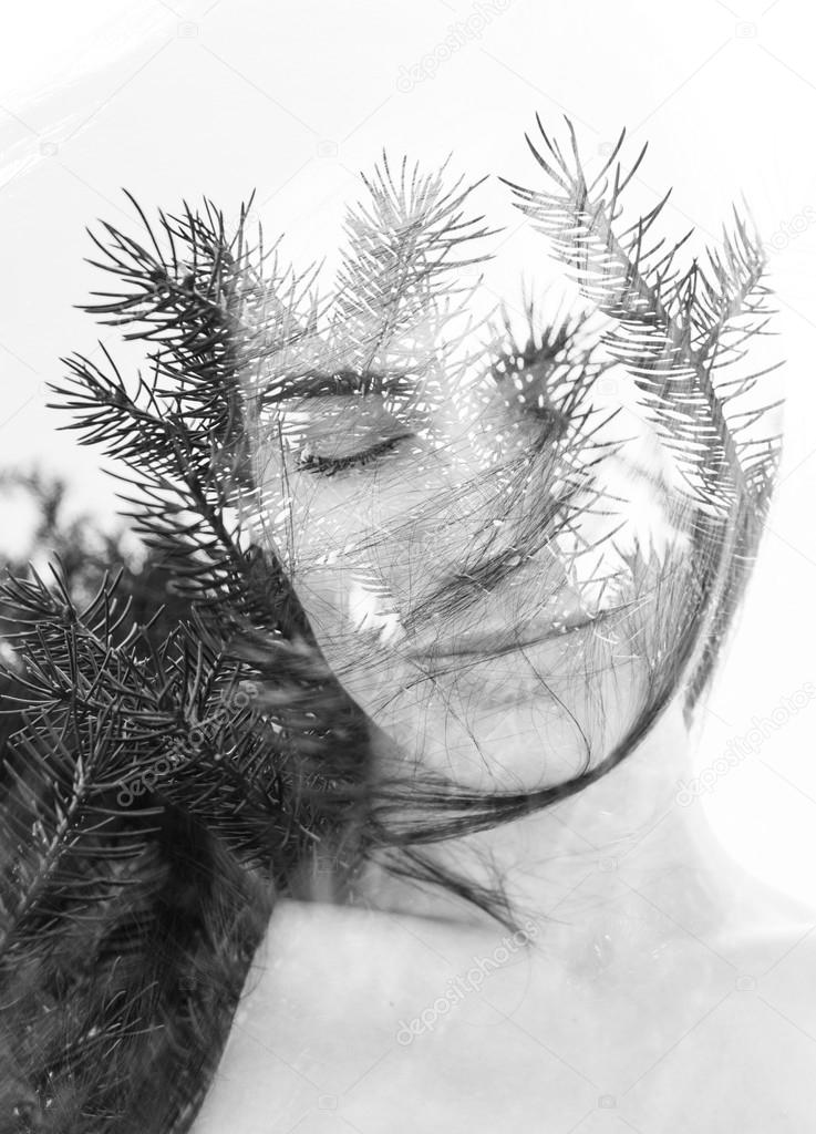 Double exposure portrait of attractive woman