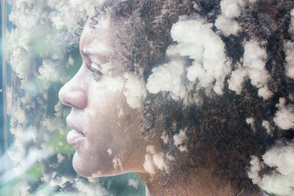 Woman combined with clouds — Stock Photo, Image