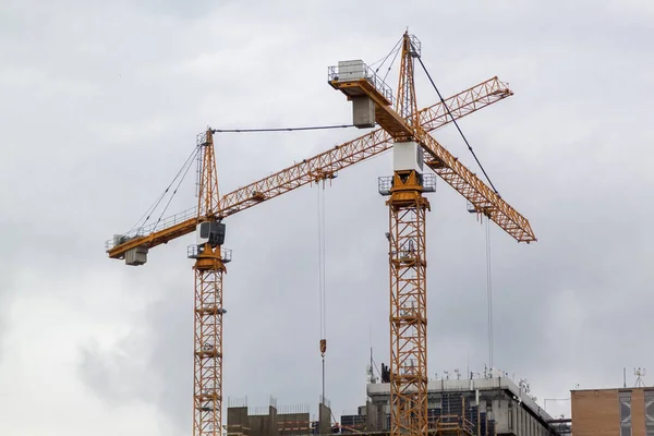 Construction Cranes Unfinished Residential Buildings Gray Sky Housing Construction Apartment — Stock Photo, Image