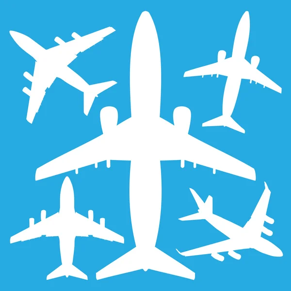 White jet airliners — Stock Vector