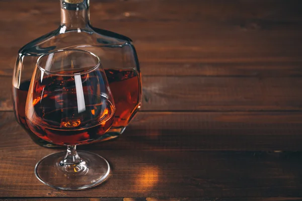 Glasses of cognac and bottle — Stock Photo, Image