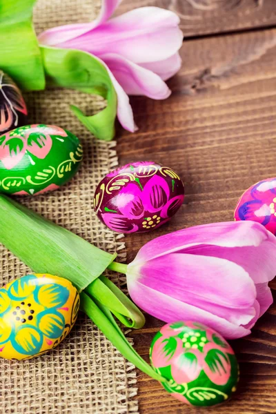 Painted Easter eggs and tulips — Stock Photo, Image