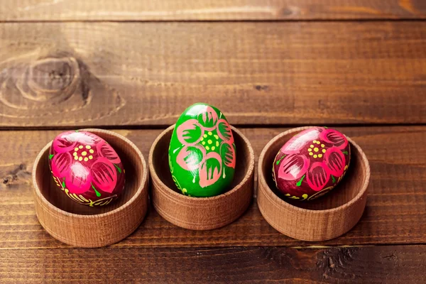 Painted Easter egg in little wooden nest — Stock Photo, Image