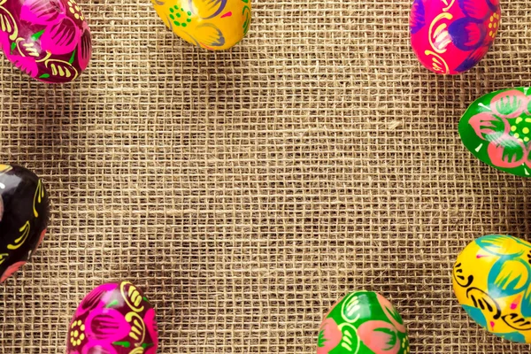 Easter eggs on burlap background — Stock Photo, Image