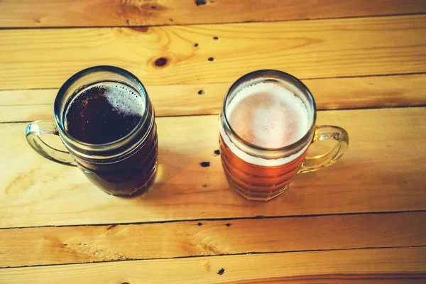 Beer on a wooden bar counter in pub — Stock Photo, Image