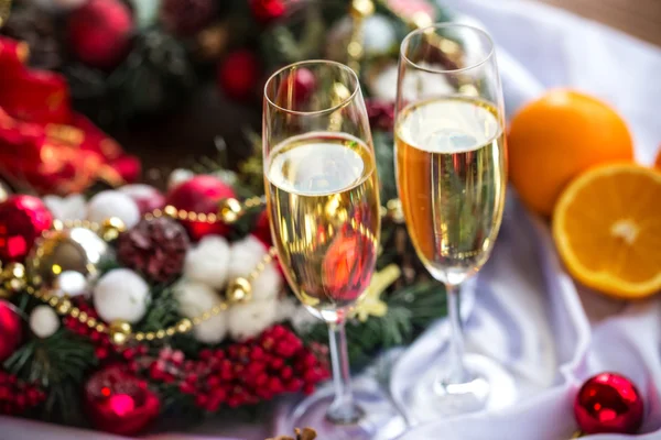 Champagne glasses and christmas decorations — Stock Photo, Image