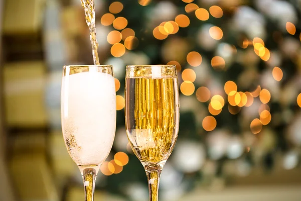 Champagne Glasses over Christmas Tree — Stock Photo, Image