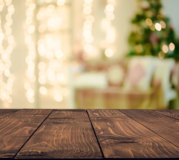 Wooden table over Christmas  tree — Stock Photo, Image