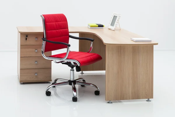 Wood desk and red armchair — Stock Photo, Image