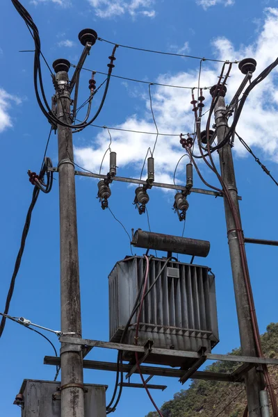 Poles with transformers on  blue sky — Stock Photo, Image