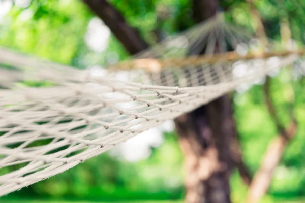 White hammock among the trees