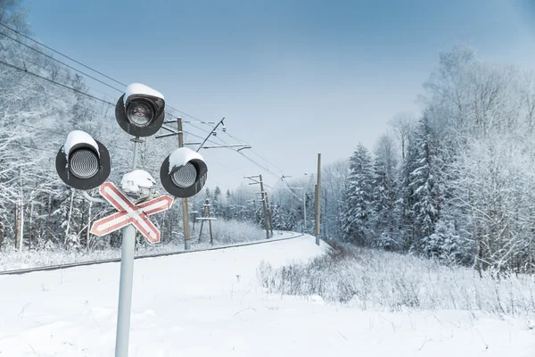 Snow covered railway crossing