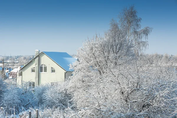 Country houses after snowfall — Stock Photo, Image