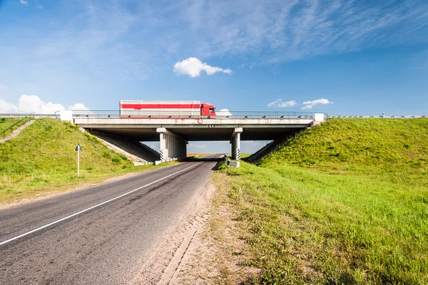 Bridge over the rural road — Stock Photo, Image