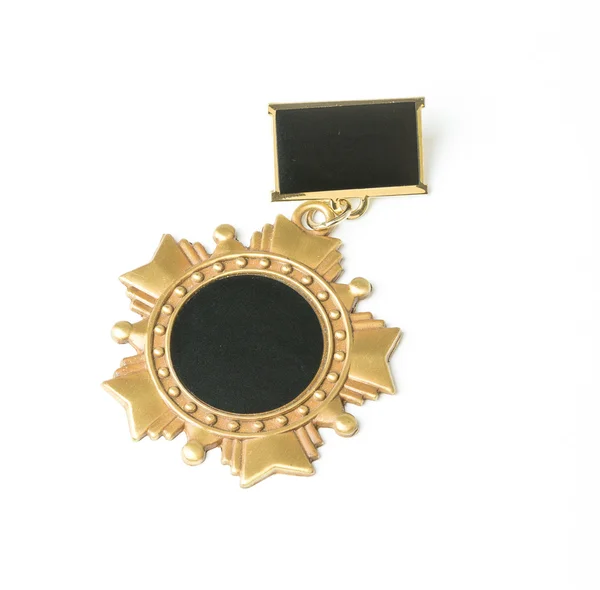 Zlatá medaile izolovaná na bílém — Stock fotografie