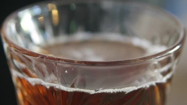 Macro of oriental turkish transparent teacup with black tea — Stock Video