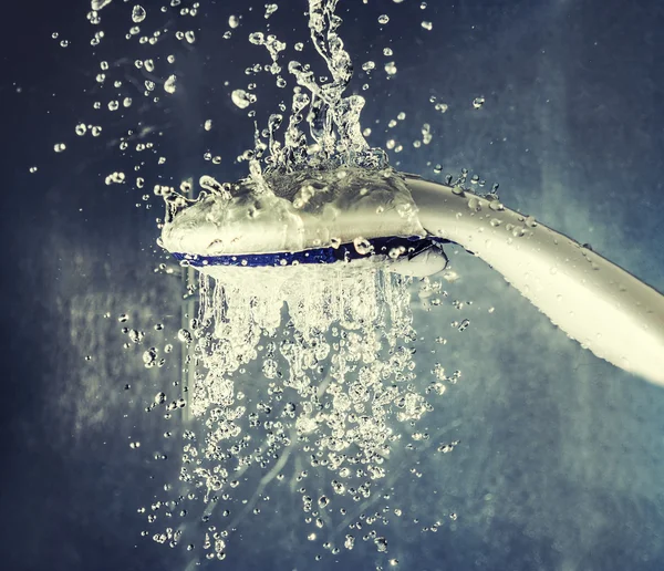 Shower head with levitating water drops instagram-like color — Stock Photo, Image