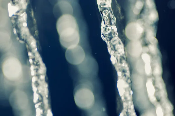 Salpicadura de agua levitar en el aire tonificado — Foto de Stock