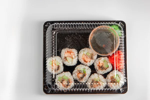 Sushi menyn i svart låda — Stockfoto