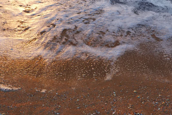 Sea beach wave water bubbles on sand copyspace — Stock Photo, Image