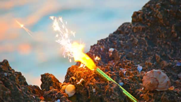 Sparkler candle and spiral shell — Stock Video