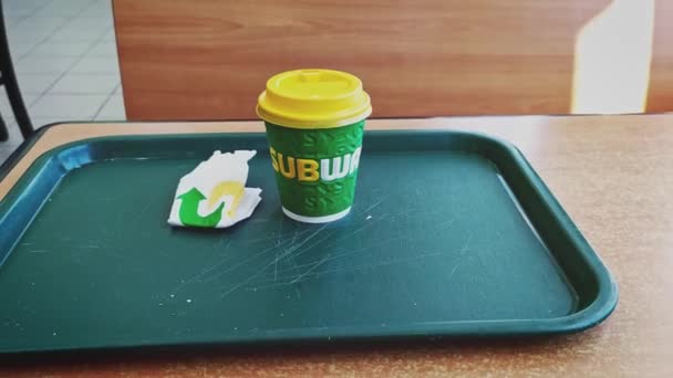 Astrakhan Russia, 11 Novemner 2019: subway fast food coffee cup on tray. — Stockvideo