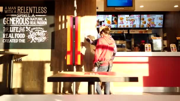 Astrakhan, Russia - 23 october 2020: KFC counter with customers time-lapse. KFC is very popular fast-food franchise all over the World. — Stock Video